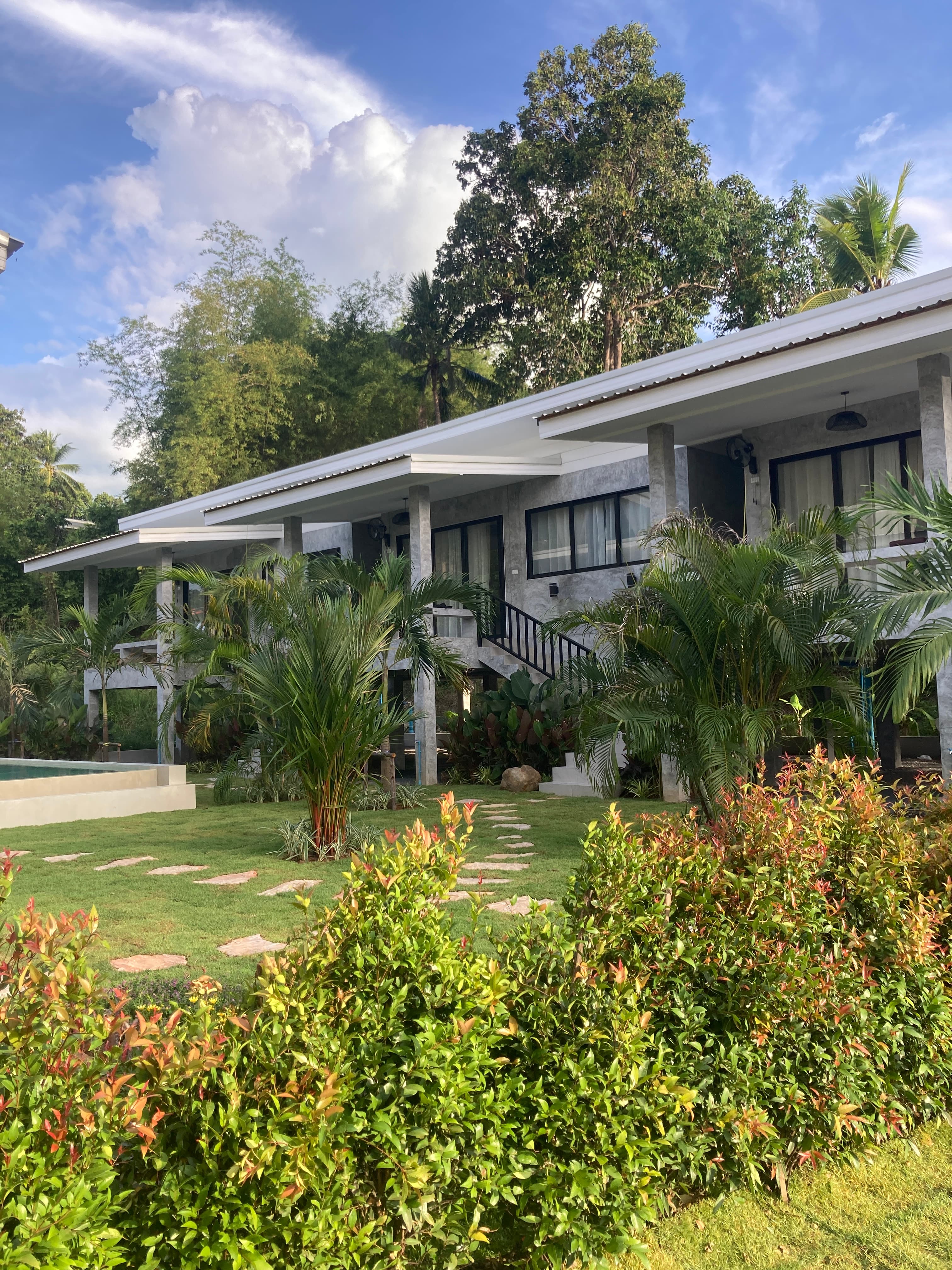 Razuberi — property overview with tropical garden and bungalows